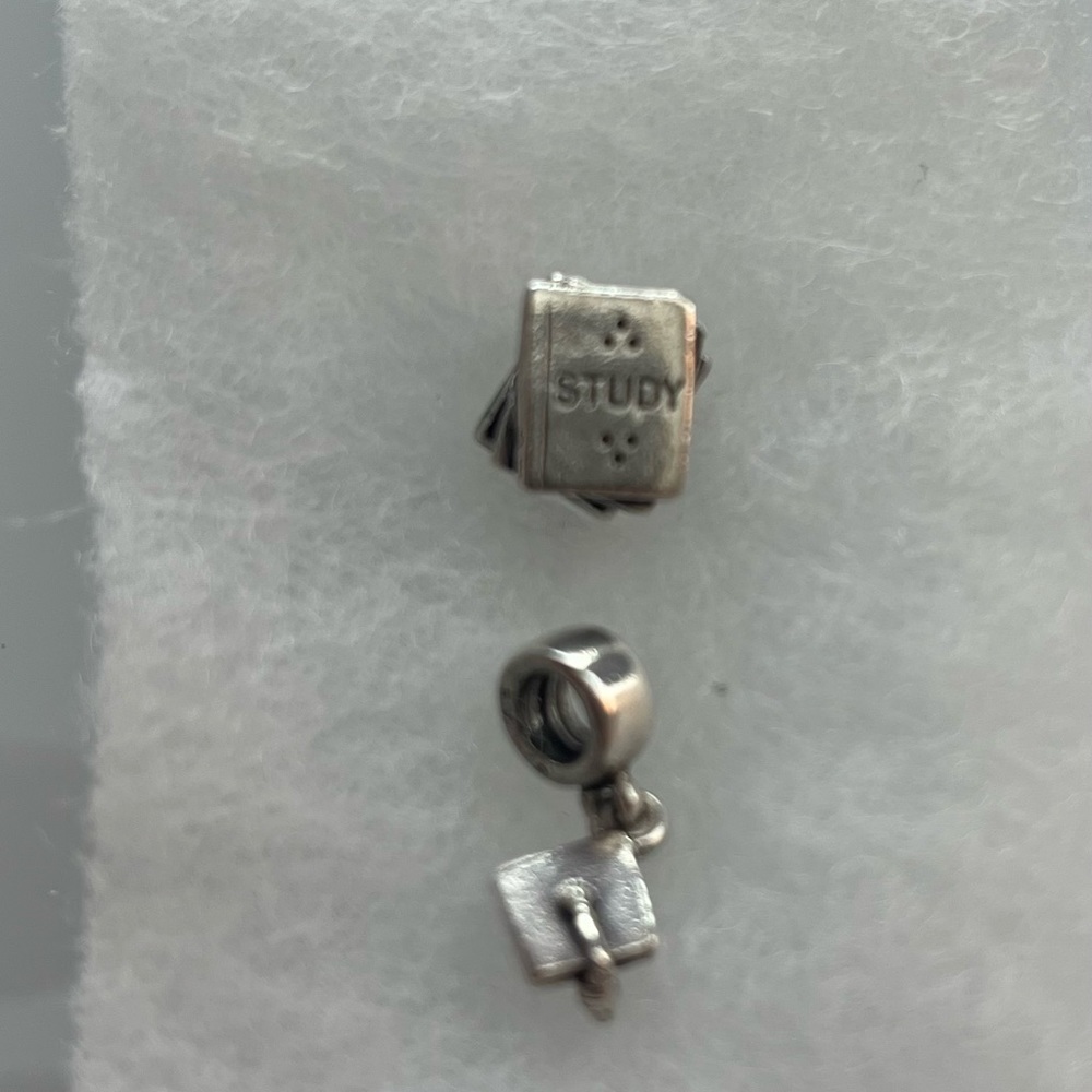 Pandora graduation and study books charms with ALE Trademark.